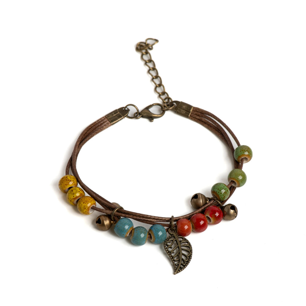 Pulsera marrón con hoja otoñal