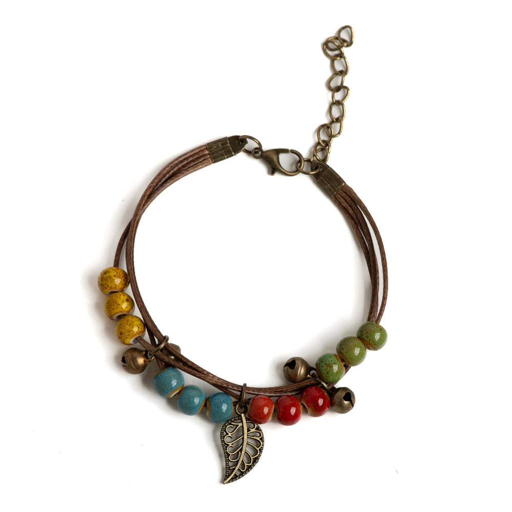 Pulsera marrón con hoja otoñal