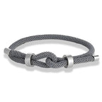 Pulsera moderna de cuerda trenzada con nudo gris