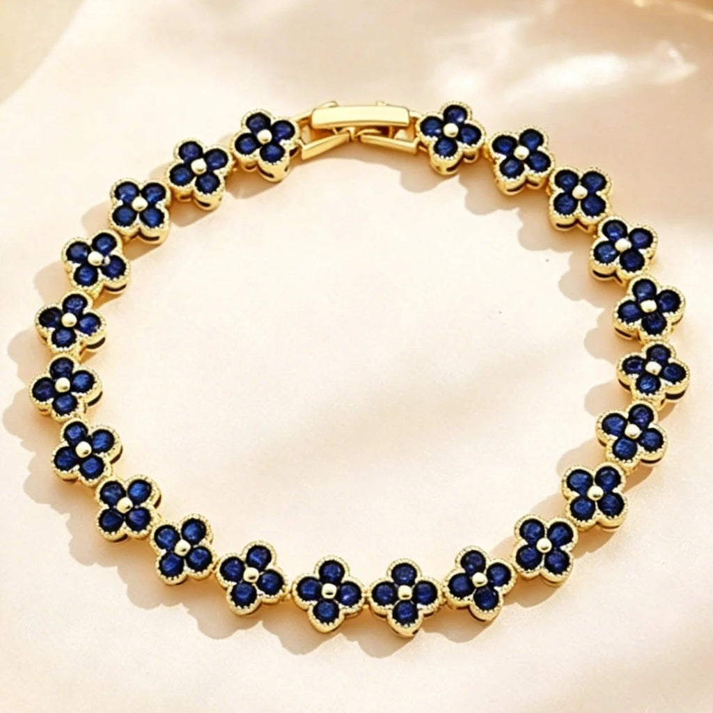 Pulsera de múltiples tréboles con cristales de colores dorado y azul