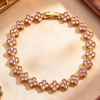 Pulsera de múltiples tréboles con cristales de colores dorado y rosa