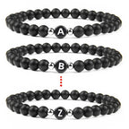 Pulsera negra inicial