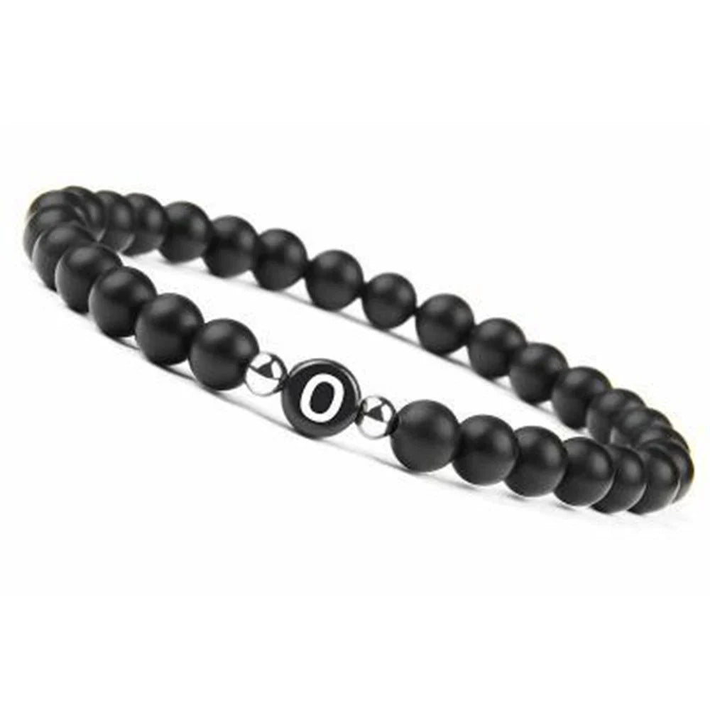 Pulsera negra inicial o