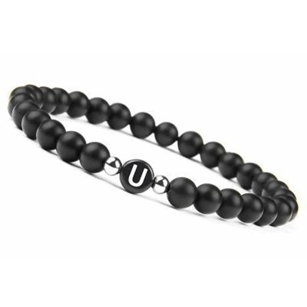 Pulsera negra inicial u