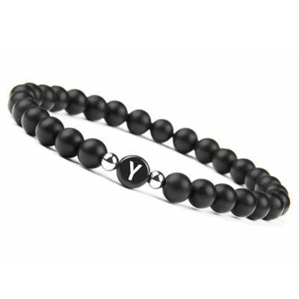 Pulsera negra inicial y