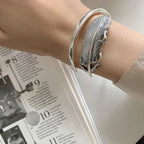 Pulsera de pluma plateada para mujer