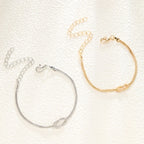 Pulsera para Pareja Nudo Entretejido Oro y Plata (Juego de 2 Pulseras)