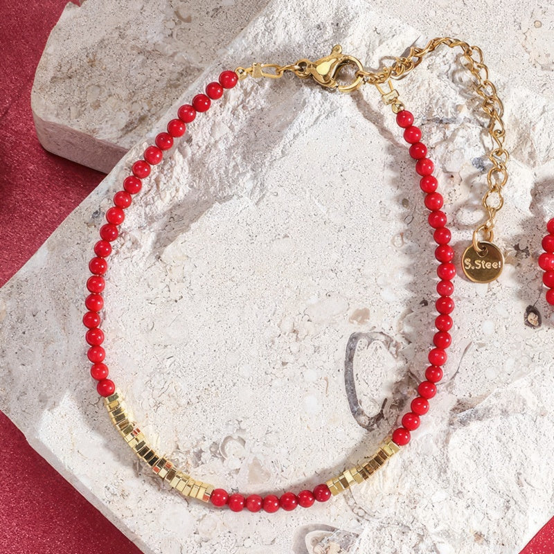 Pulsera roja y dorada coral