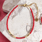 Pulsera roja y dorada coral