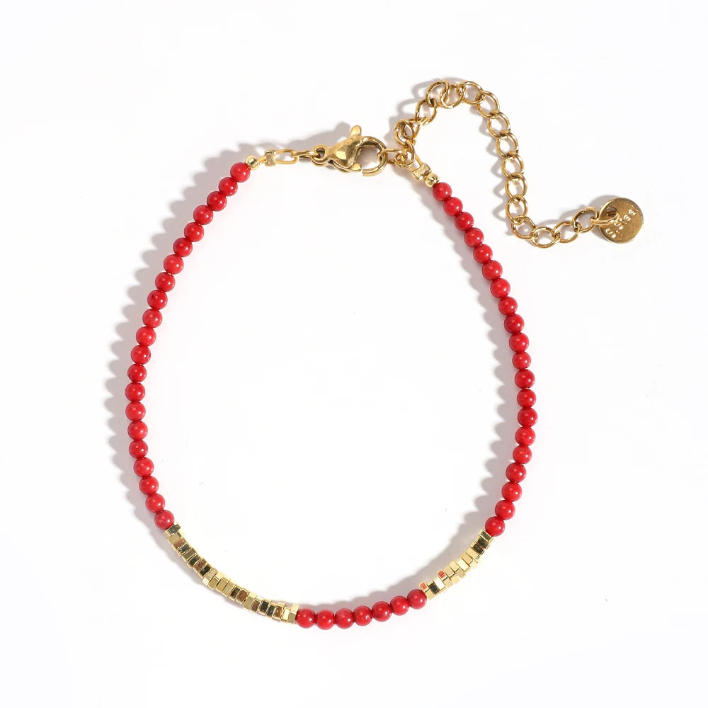 Pulsera roja y dorada coral