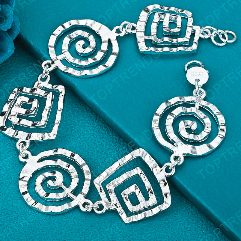 Pulsera espiral plateada para mujer