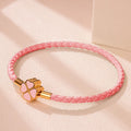 Pulsera Trenzada de Cuero con Trébol de 4 Hojas rosa
