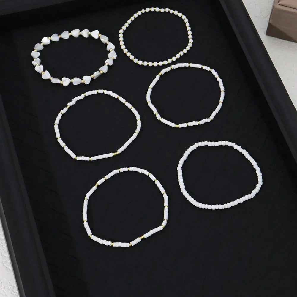 Pulseras de Perlas y Corazones