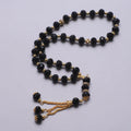 Rosario musulmán elegante - Tasbih islámico 33 cuentas negro y dorado