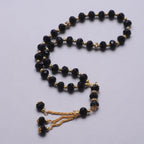 Rosario musulmán elegante - Tasbih islámico 33 cuentas negro y dorado