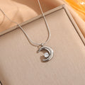 Collier avec pendentif croissant de lune et étoile solitaire couchée argent