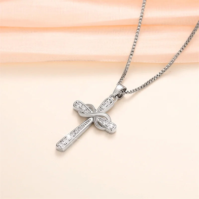 Necklace with intertwined cross and infinity symbol pendant