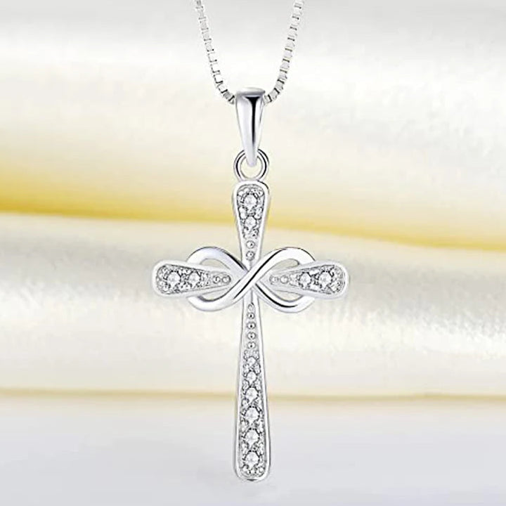Necklace with intertwined cross and infinity symbol pendant
