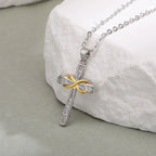 Necklace with two-tone cross and infinity symbol pendant