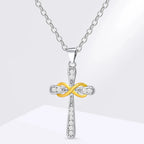 Necklace with two-tone cross and infinity symbol pendant