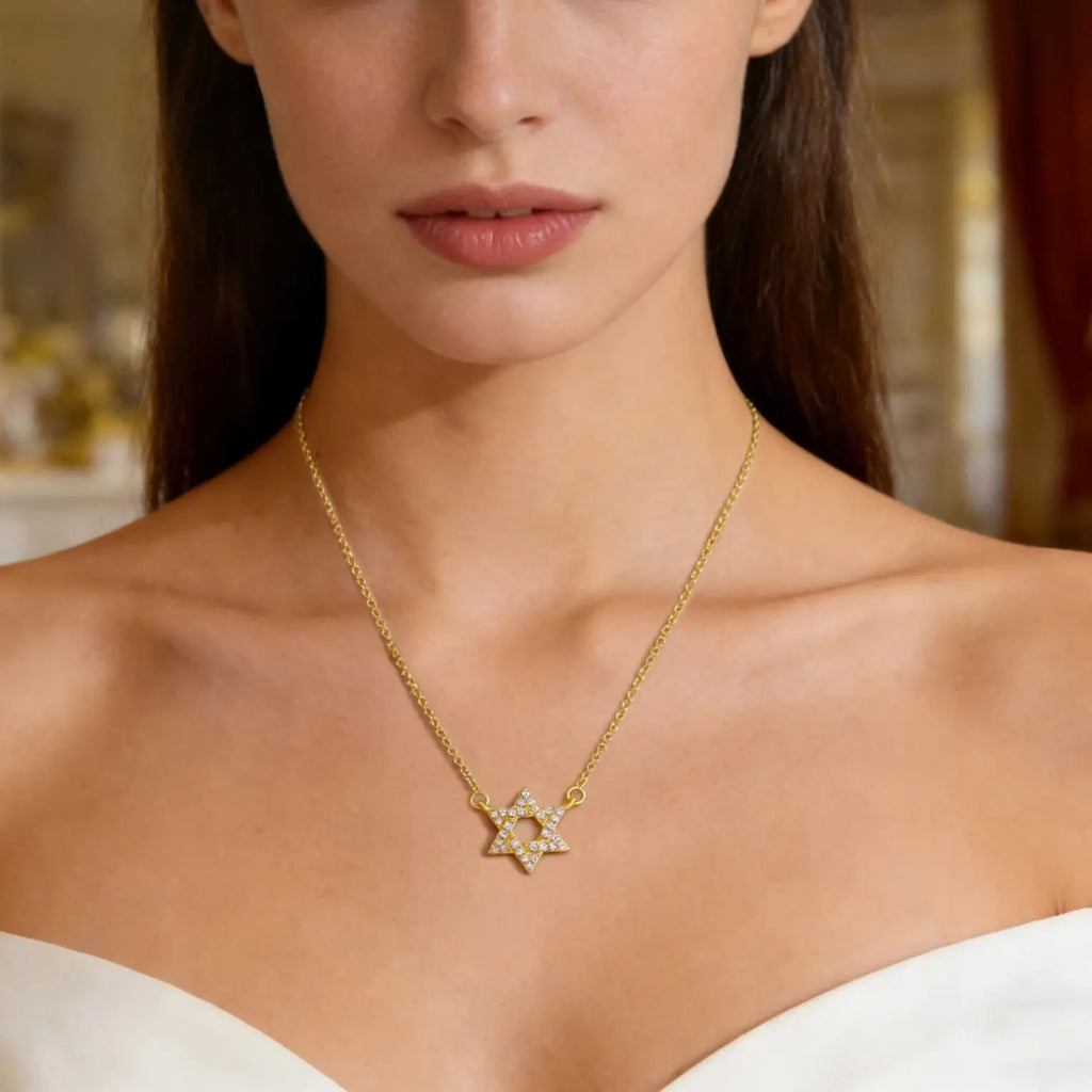 Collar con colgante de la <span data-glossary-id="etoile-de-david">estrella de David</span> en strass símbolo judío oro