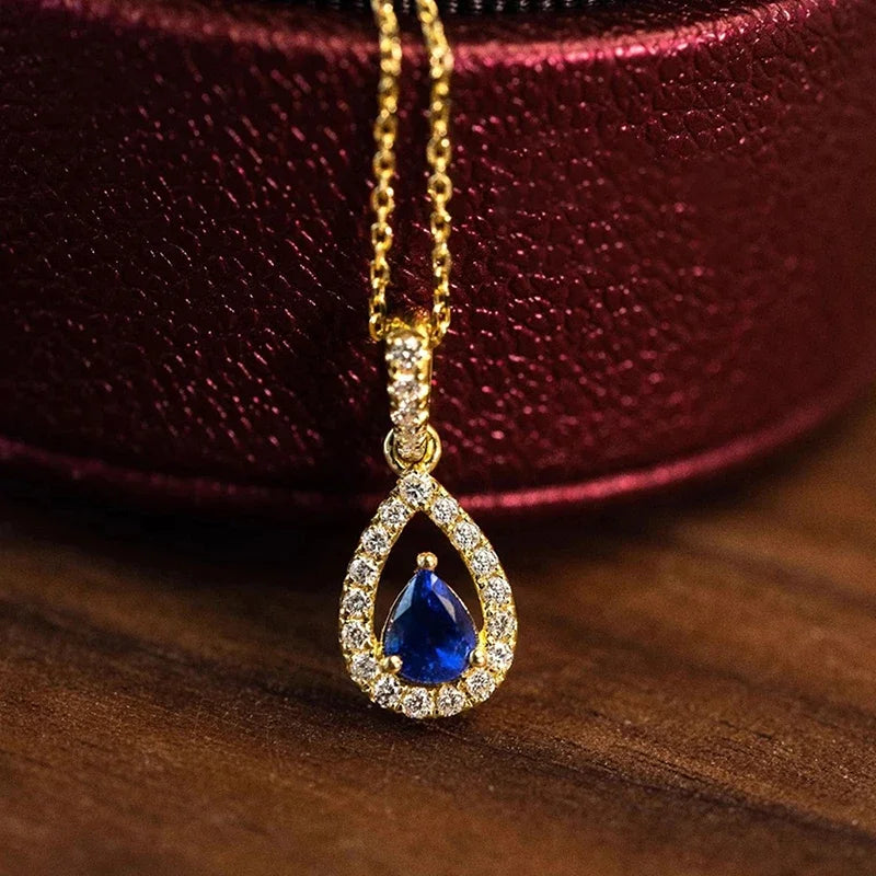 Collar con colgante de doble gota de agua y cristal azul zafiro