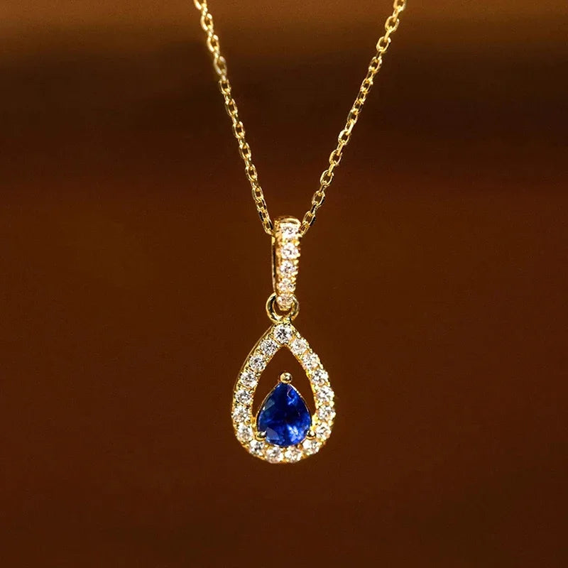 Collar con colgante de doble gota de agua y cristal azul zafiro