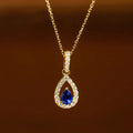 Collar con colgante de doble gota de agua y cristal azul zafiro