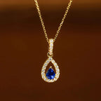 Collar con colgante de doble gota de agua y cristal azul zafiro