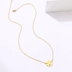 Collar con colgante de hoja de trébol de la suerte dorado
