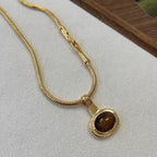 Necklace with oval tiger's eye stone pendant