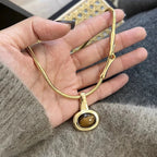 Necklace with oval tiger's eye stone pendant