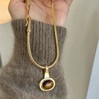 Necklace with oval tiger's eye stone pendant
