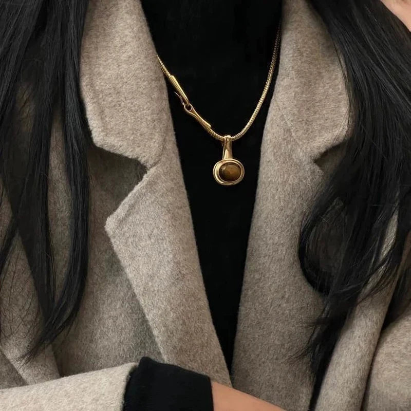 Necklace with oval tiger's eye stone pendant
