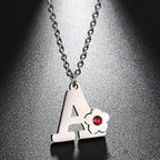 Collar con colgante de inicial y flor 
