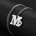 Collar con colgante de inicial y flor m