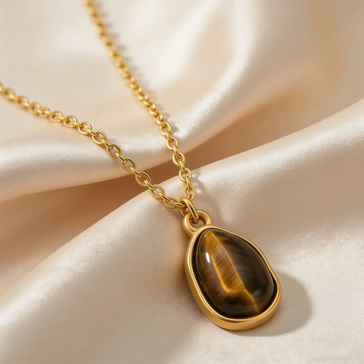 Necklace with geometric pendant and tiger's eye stone