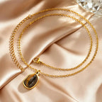 Necklace with geometric pendant and tiger's eye stone