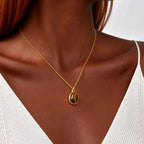 Necklace with geometric pendant and tiger's eye stone