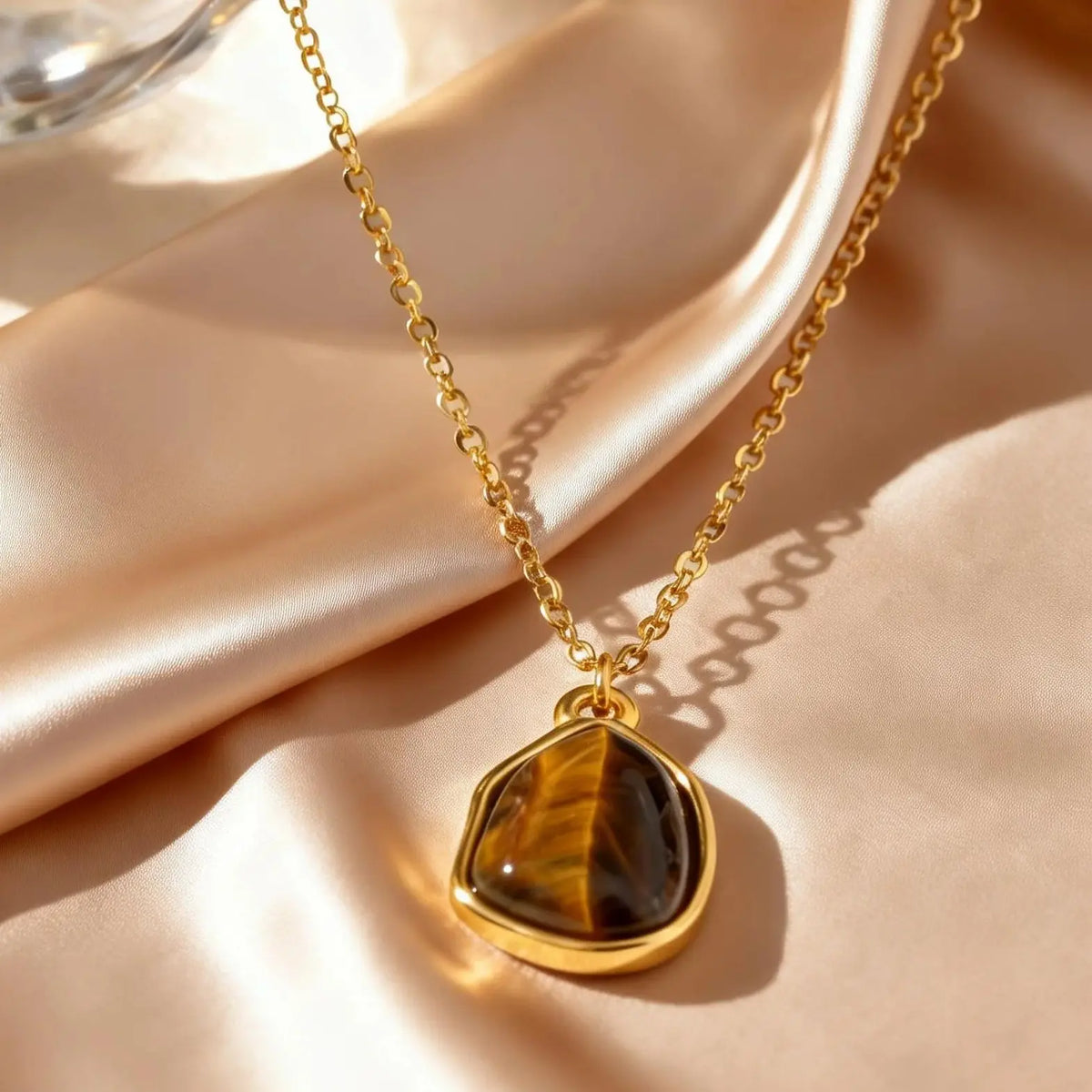 Necklace with geometric pendant and tiger's eye stone