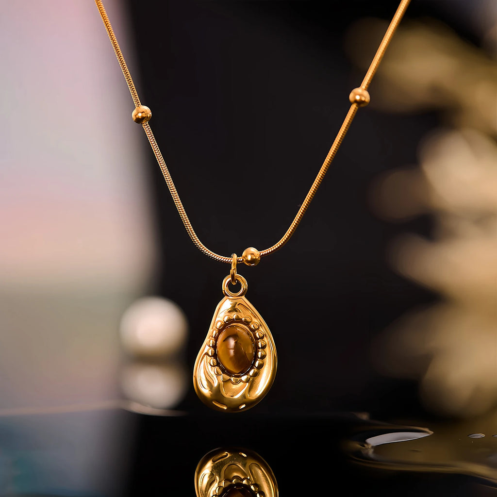 Necklace with teardrop pendant in natural tiger's eye stone