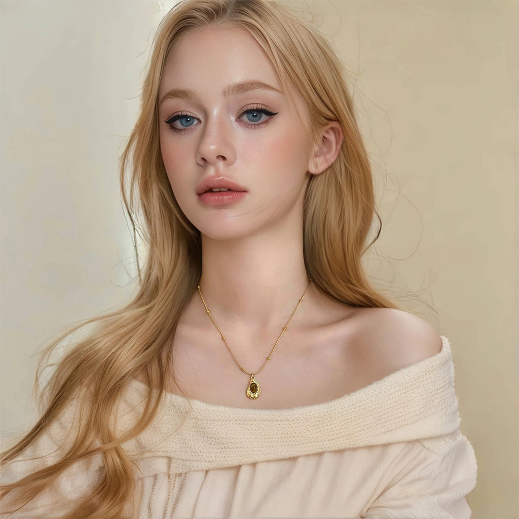 Necklace with teardrop pendant in natural tiger's eye stone