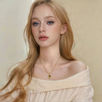 Necklace with teardrop pendant in natural tiger's eye stone