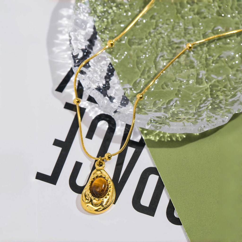 Necklace with teardrop pendant in natural tiger's eye stone