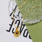 Necklace with teardrop pendant in natural tiger's eye stone