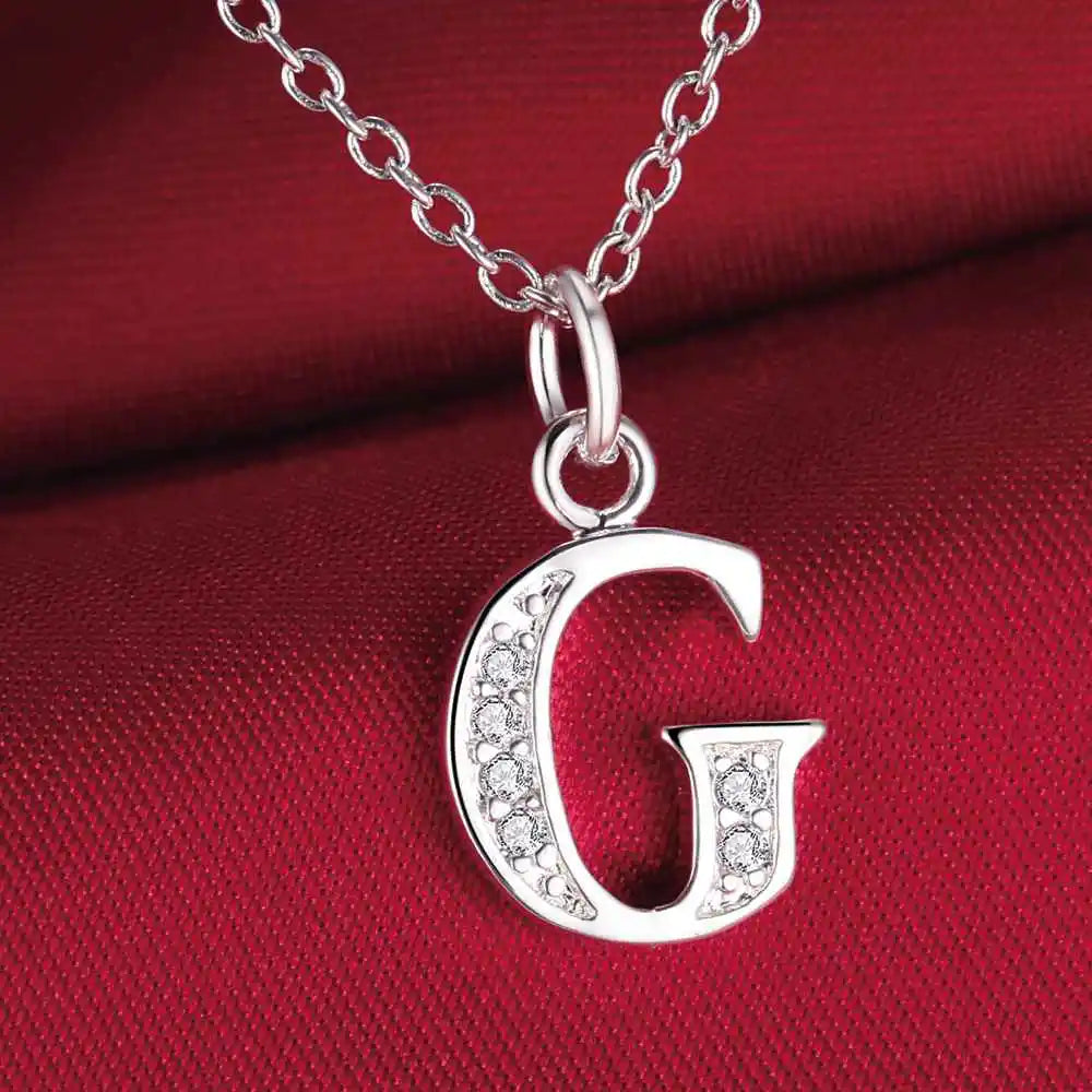 Collar largo con colgante inicial g