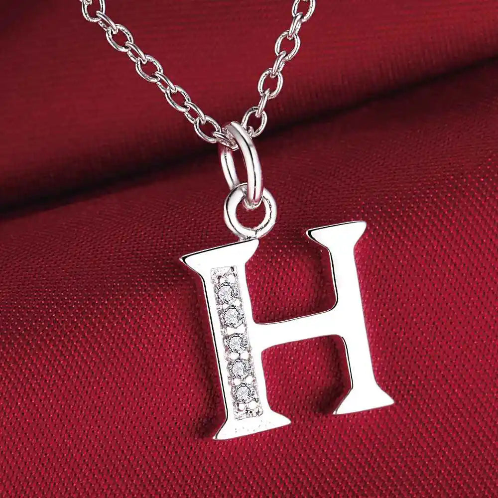 Collar largo con colgante inicial h