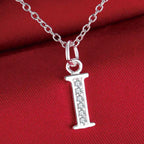 Collar largo con colgante inicial i