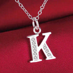 Collar largo con colgante inicial k