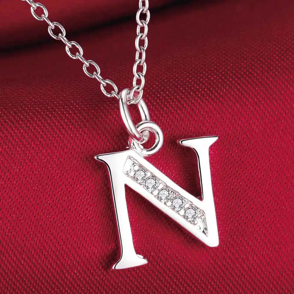 Collar largo con colgante inicial n